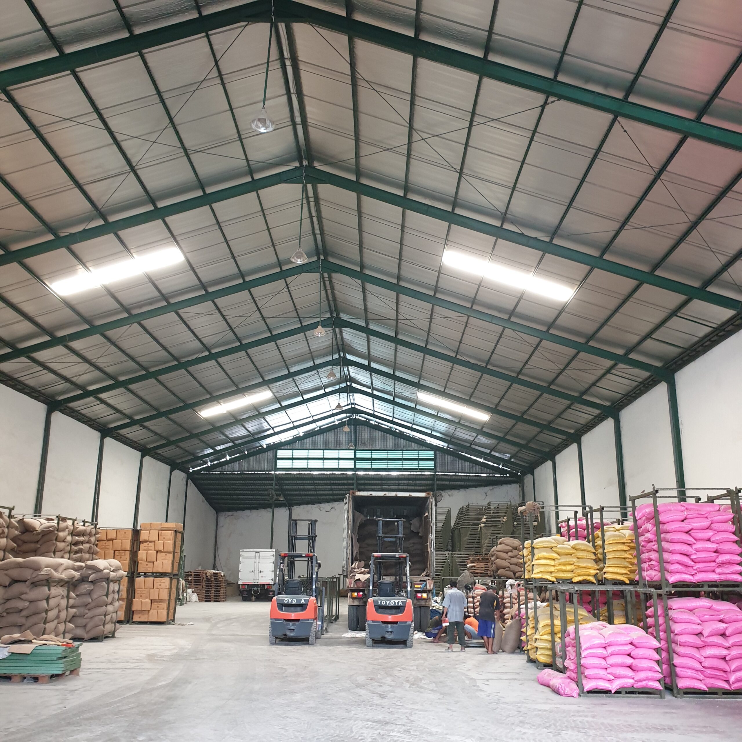 This image depicts PT Sumber Rejeki Palawija's warehouse as Indonesia's leading agri crops distribution company.